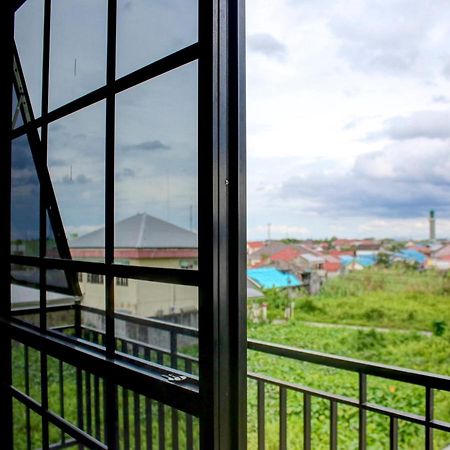 Oyo 90162 Remboelan Guest House Sungai Lutus Bagian luar foto