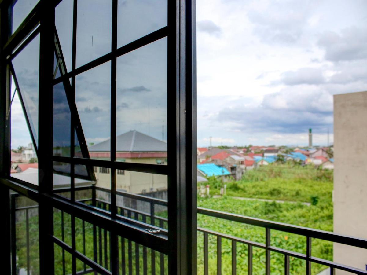 Oyo 90162 Remboelan Guest House Sungai Lutus Bagian luar foto